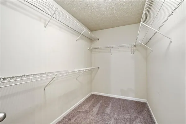 a view of a room with racks on the wall