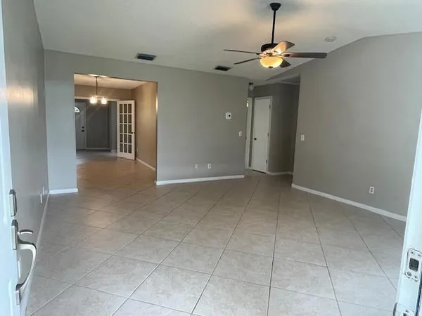 a view of an empty room with a window