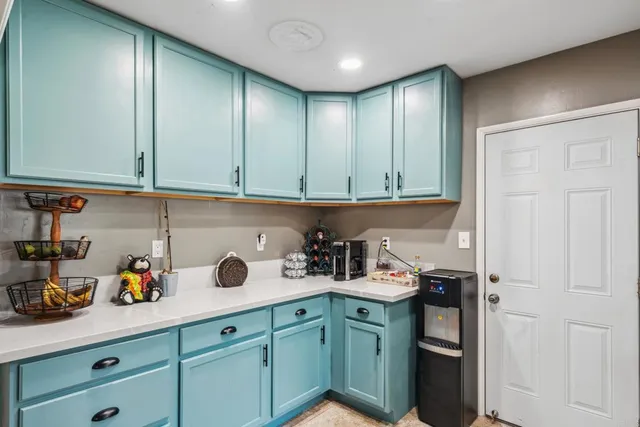 a kitchen with a sink and cabinets