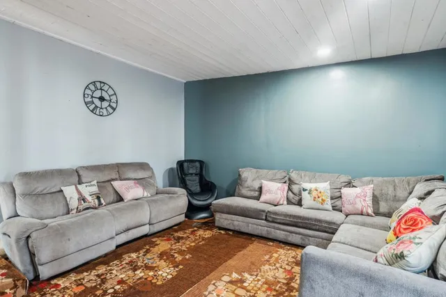 a living room with furniture and a couch