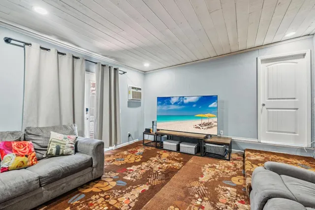 a living room with furniture and a rug