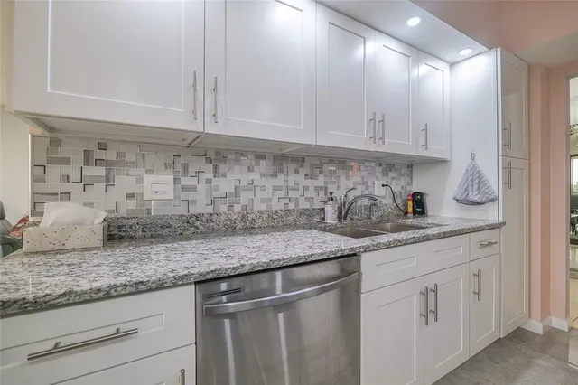 a bathroom with a sink vanity and a mirror