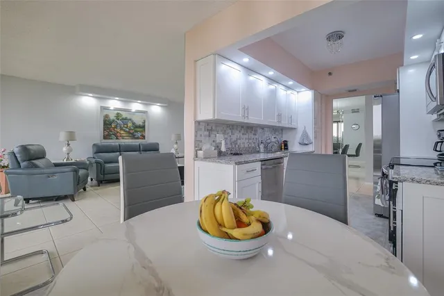 a bathroom with a double vanity sink toilet and a mirror