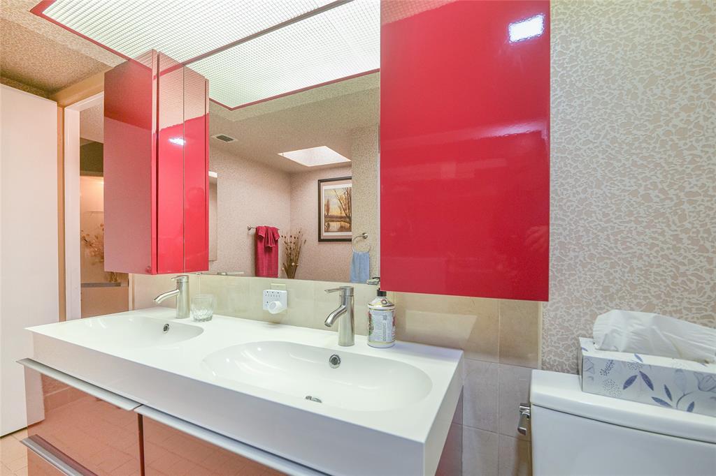 7300 Radice Court, Unit 404 Lauderhill, FL 33319 - Photo 26 of 85 a bathroom with a sink vanity and a mirror