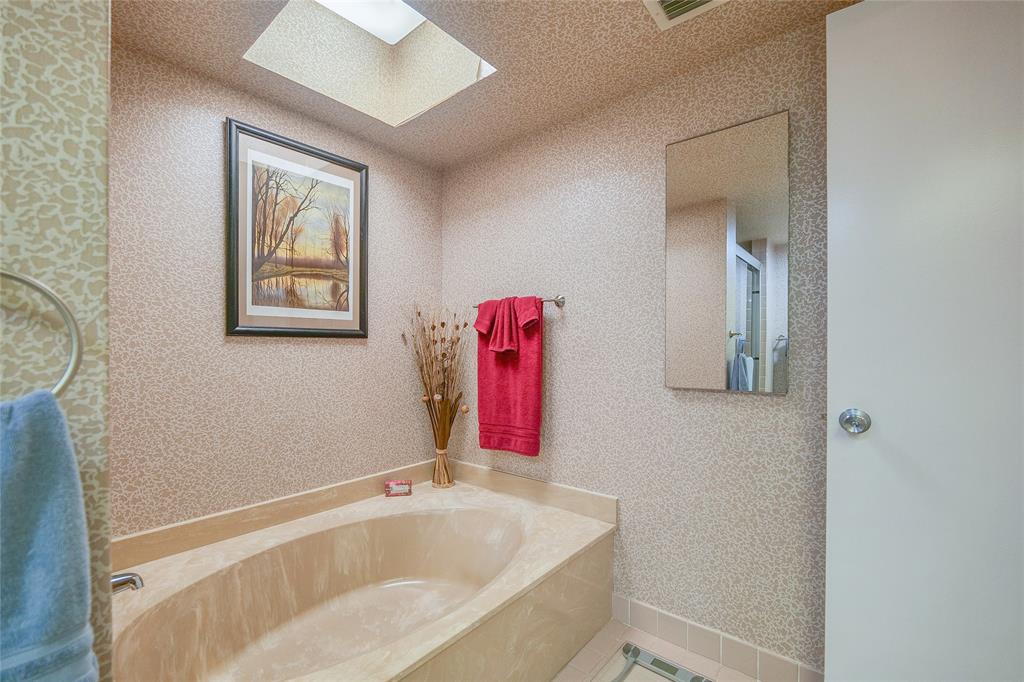 7300 Radice Court, Unit 404 Lauderhill, FL 33319 - Photo 27 of 85 a bathroom with a bathtub and a shower