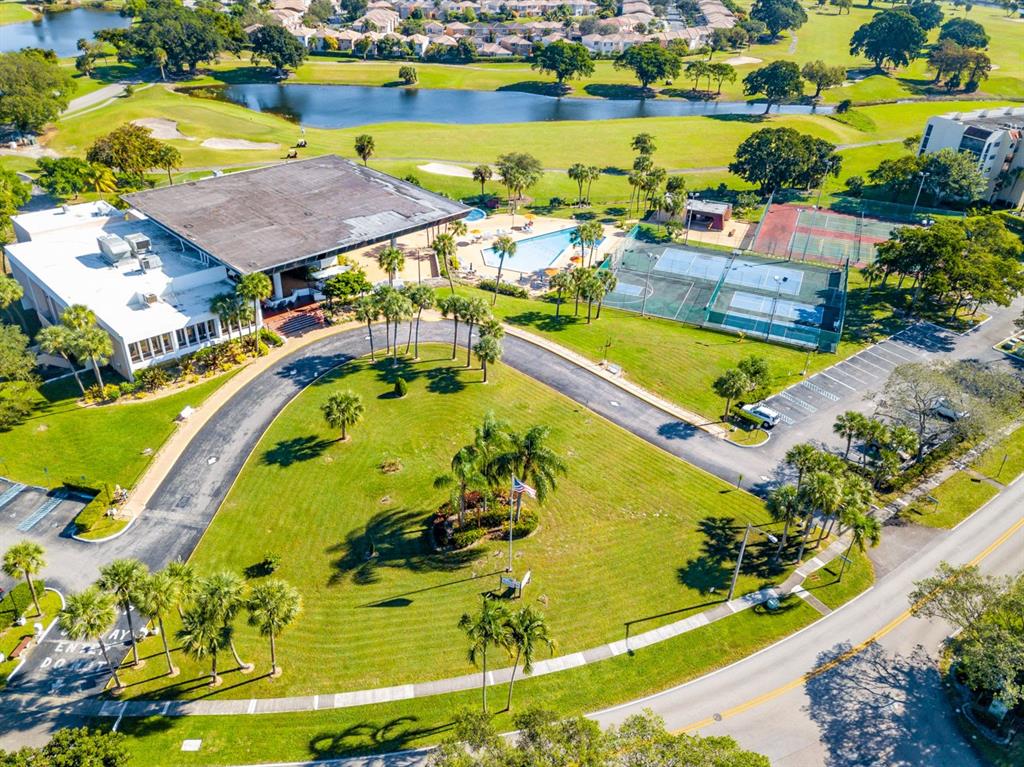 7300 Radice Court, Unit 404 Lauderhill, FL 33319 - Photo 43 of 85 an aerial view of a house with a swimming pool and outdoor seating