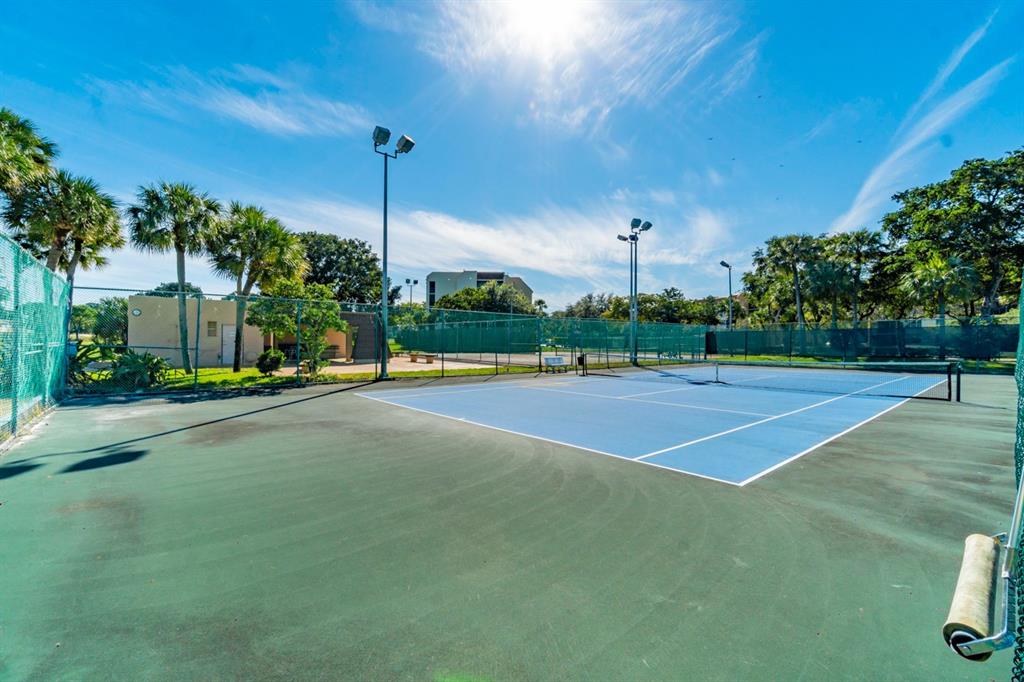 7300 Radice Court, Unit 404 Lauderhill, FL 33319 - Photo 66 of 85 a view of a tennis court