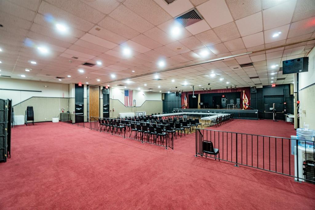 7300 Radice Court, Unit 404 Lauderhill, FL 33319 - Photo 68 of 85 a big room with lots of furniture and a chandelier