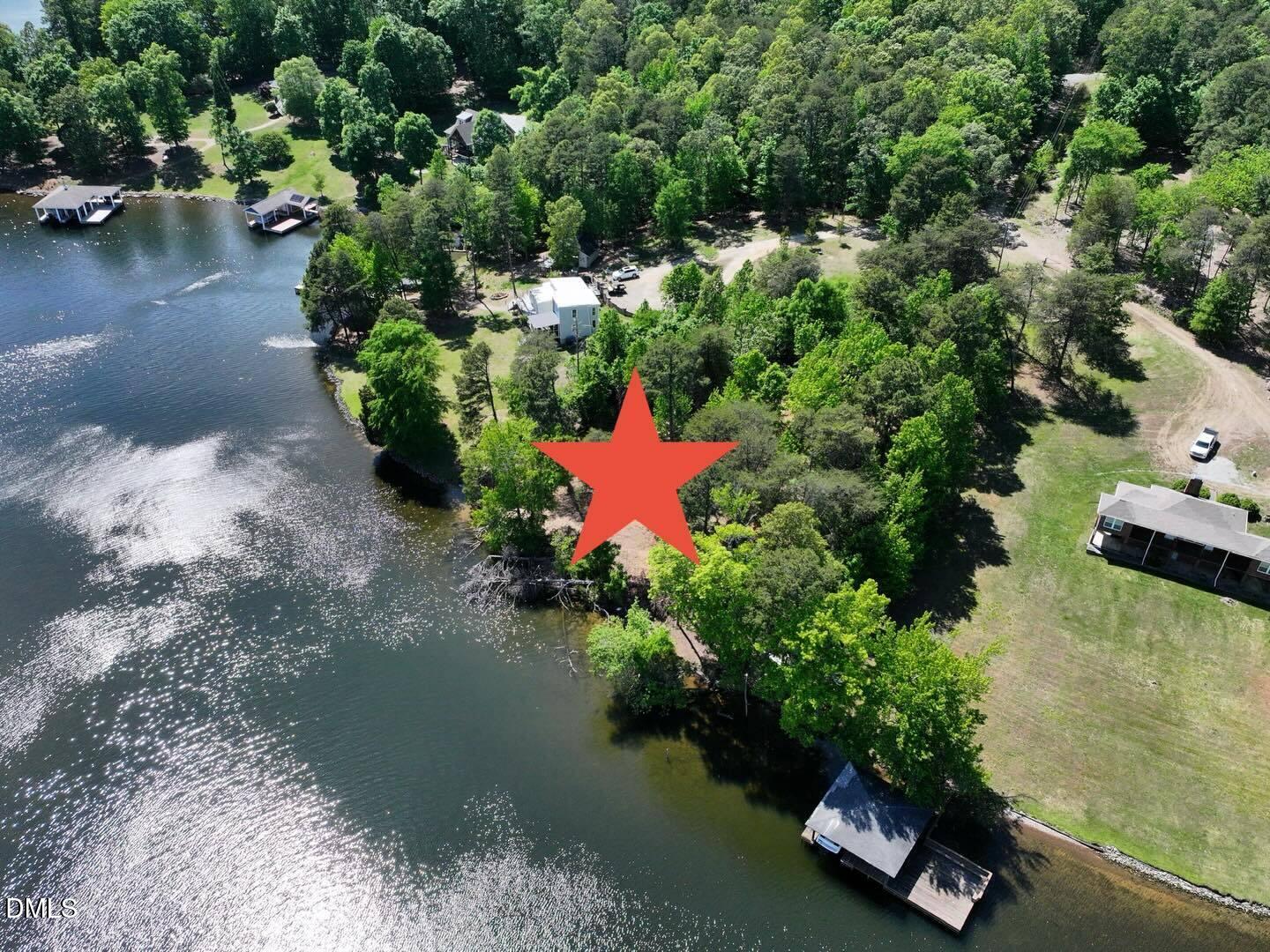 52-lot#) Pinesborough Estates Road Semora, NC 27343 - Photo 1 of 6 an aerial view of a house with a yard and lake view