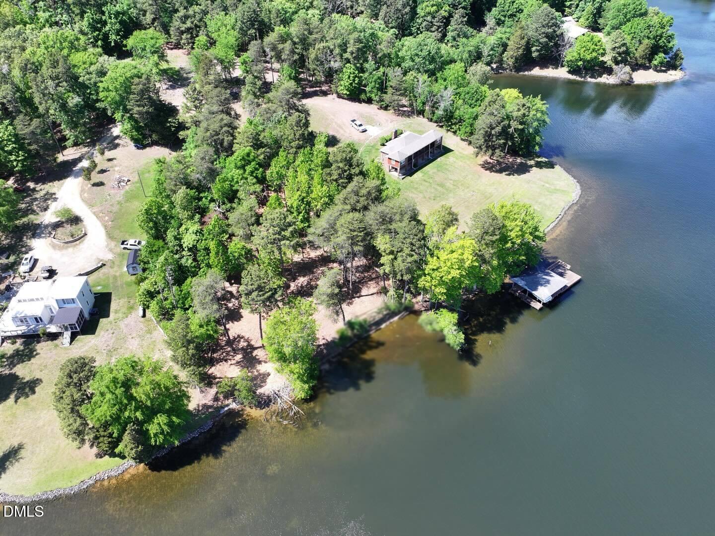 52-lot#) Pinesborough Estates Road Semora, NC 27343 - Photo 5 of 6 an aerial view of a house with a yard and lake view