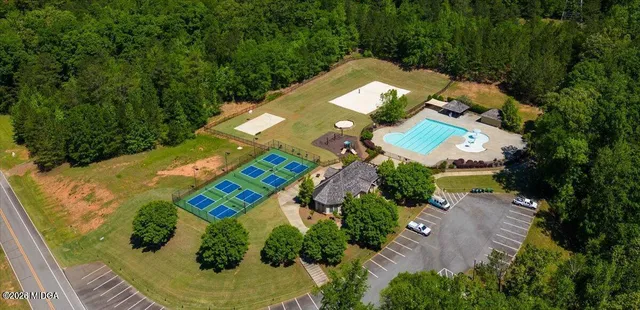 a view of a swimming pool with lounge chairs