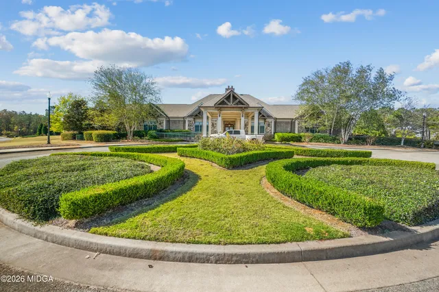 a view of a golf course with a lake
