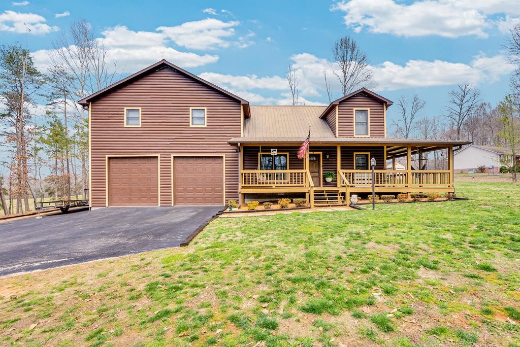 465 Hickory Lane Sparta, TN 38583 - Photo 1 of 46 a front view of a house with a yard table and chairs