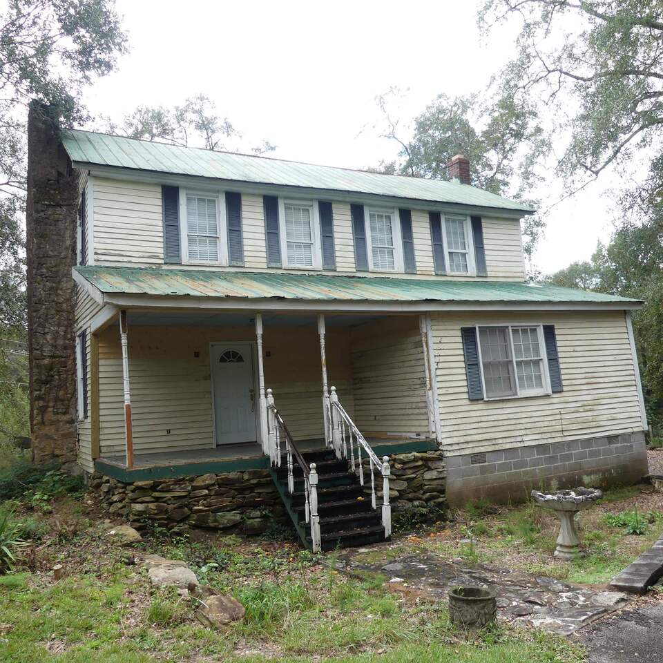 646 Wagers Mill Road Newnan, GA 30263 - Photo 1 of 1 a front view of a house with a yard