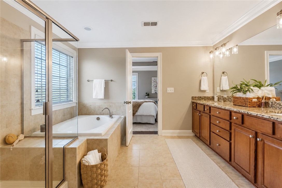 15 Fawn Hill Drive Anderson, SC 29621 - Photo 23 of 38 This spacious bathroom offers a relaxing soaking tub and ample counter space for daily routines.