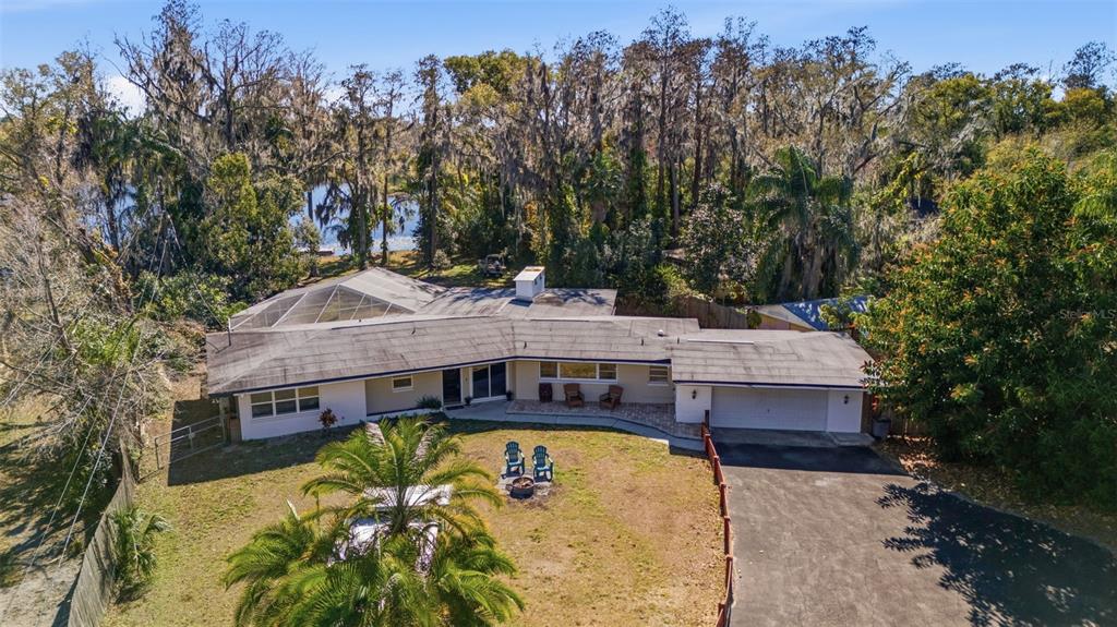 aerial view of a house with swimming pool and sitting area