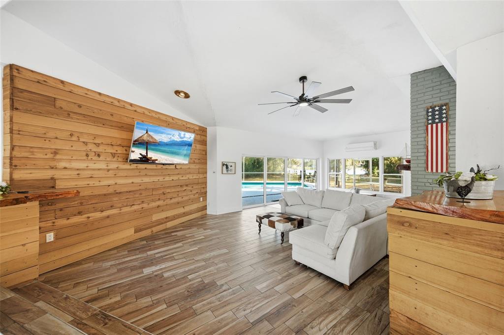 9214 Rhea Drive Odessa, FL 33556 - Photo 11 of 67 a living room with furniture and a large window