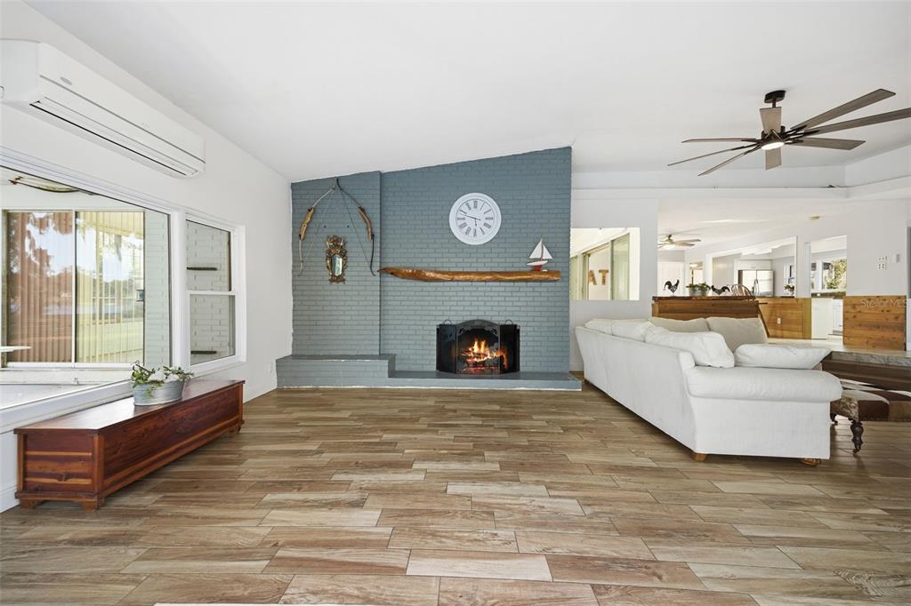 9214 Rhea Drive Odessa, FL 33556 - Photo 12 of 67 a living room with furniture and a fireplace