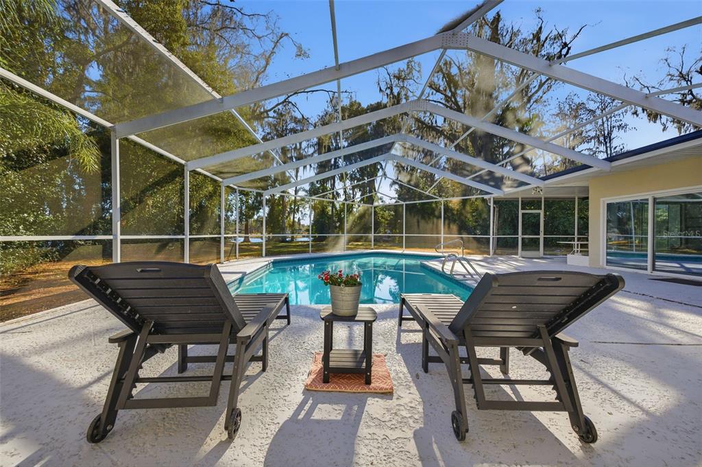 9214 Rhea Drive Odessa, FL 33556 - Photo 25 of 67 a view of a chairs and table in a patio
