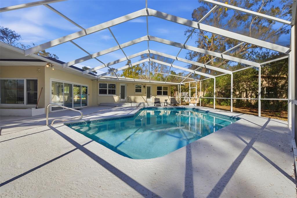 9214 Rhea Drive Odessa, FL 33556 - Photo 28 of 67 a view of a backyard with a swimming pool