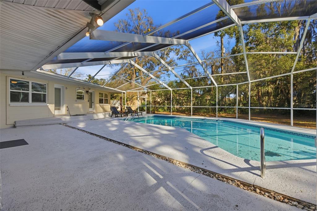9214 Rhea Drive Odessa, FL 33556 - Photo 30 of 67 a view of a backyard with wooden fence
