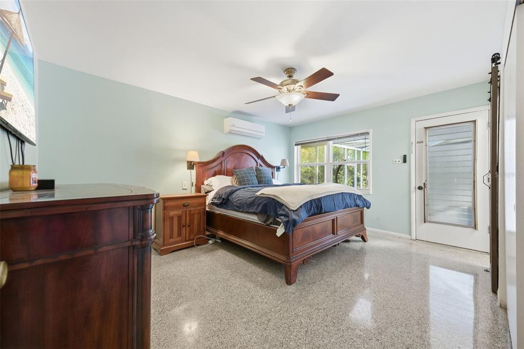 9214 Rhea Drive Odessa, FL 33556 - Photo 31 of 67 a bedroom with a bed and a chandelier