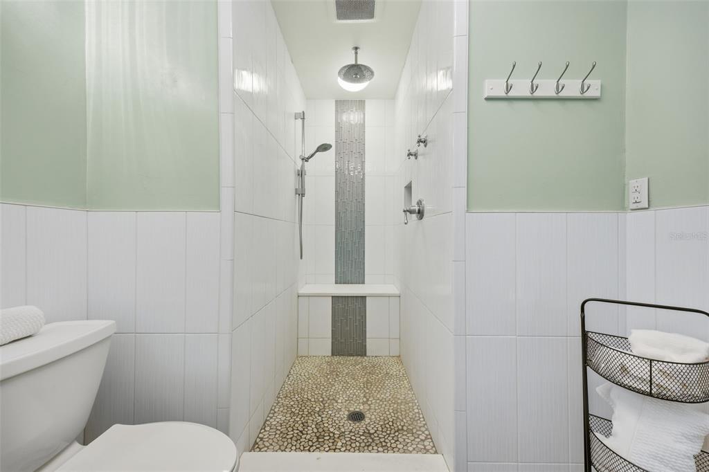 9214 Rhea Drive Odessa, FL 33556 - Photo 34 of 67 a bathroom with a granite countertop sink a toilet and shower