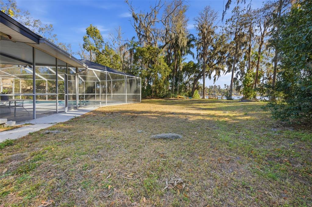 9214 Rhea Drive Odessa, FL 33556 - Photo 44 of 67 a view of a house with a yard and sitting area