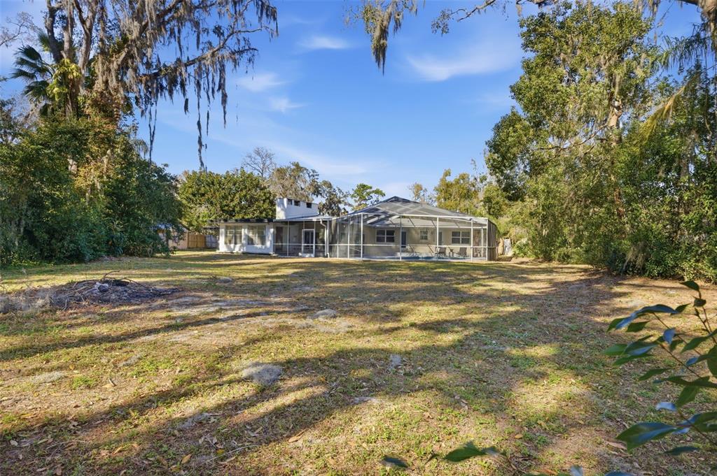 9214 Rhea Drive Odessa, FL 33556 - Photo 45 of 67 a front view of a house with a yard