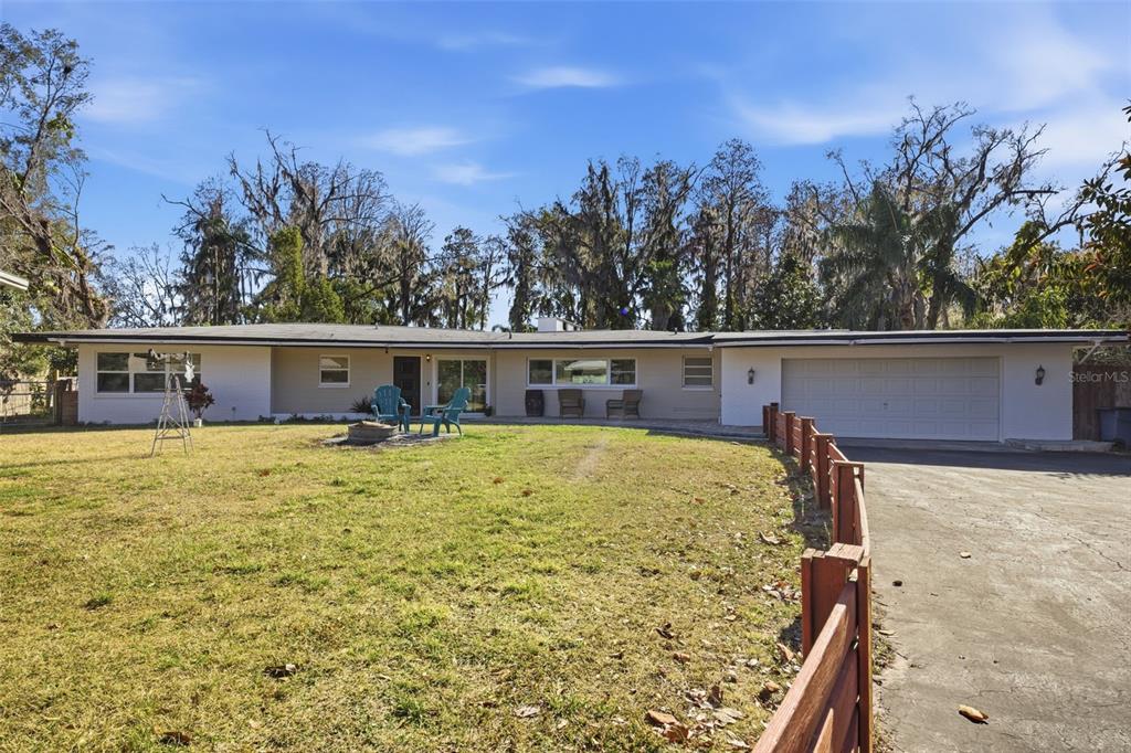 9214 Rhea Drive Odessa, FL 33556 - Photo 54 of 67 a view of a house with backyard and trees