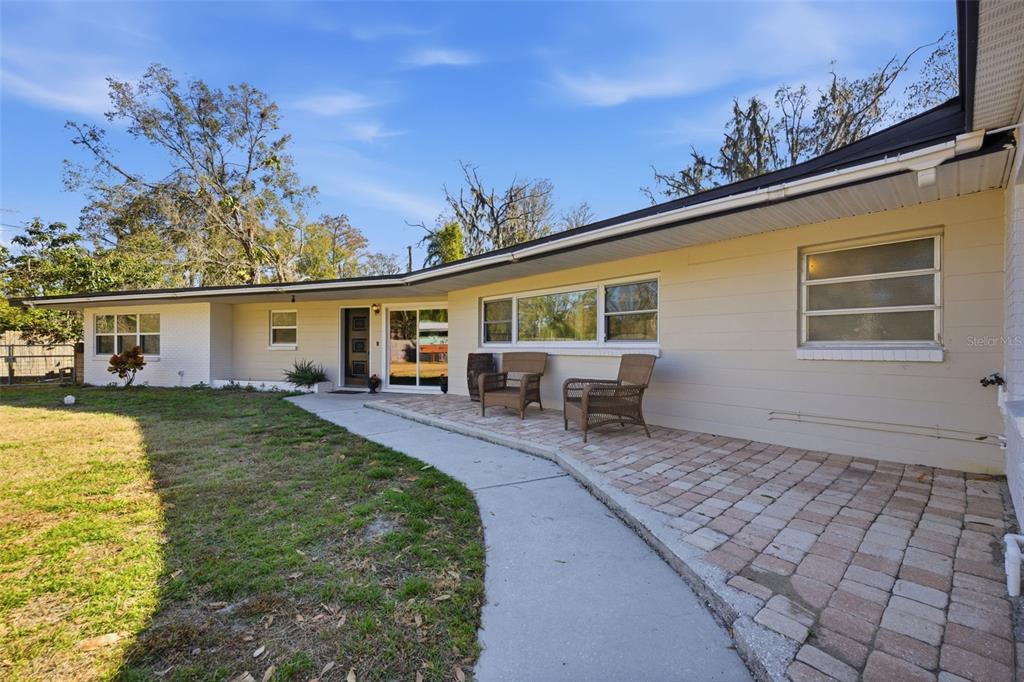 9214 Rhea Drive Odessa, FL 33556 - Photo 55 of 67 a view of a house with backyard and sitting area