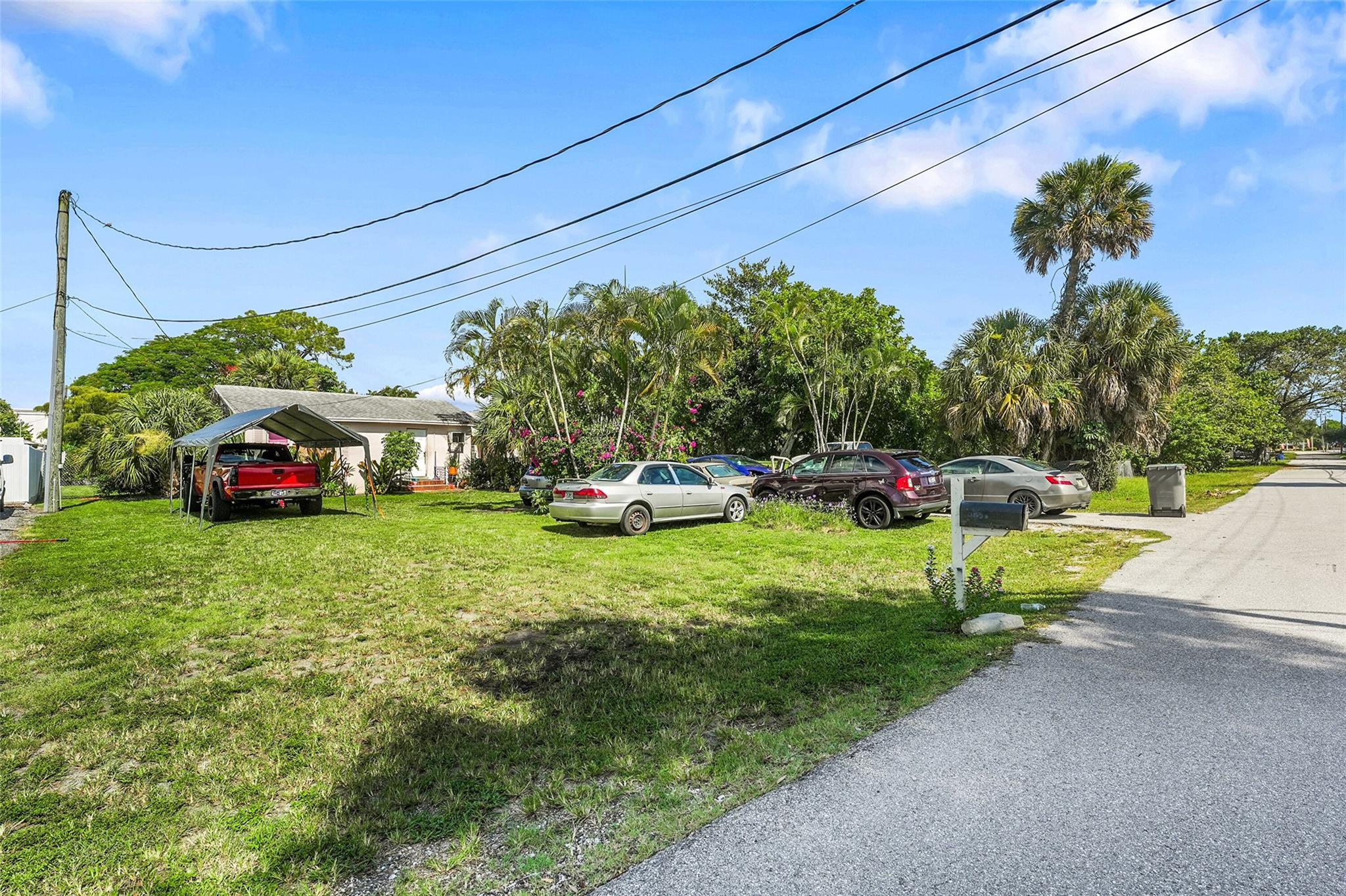 1865 Donnell Road West Palm Beach, FL 33409 - Photo 9 of 10 a view of a car parked in front of house