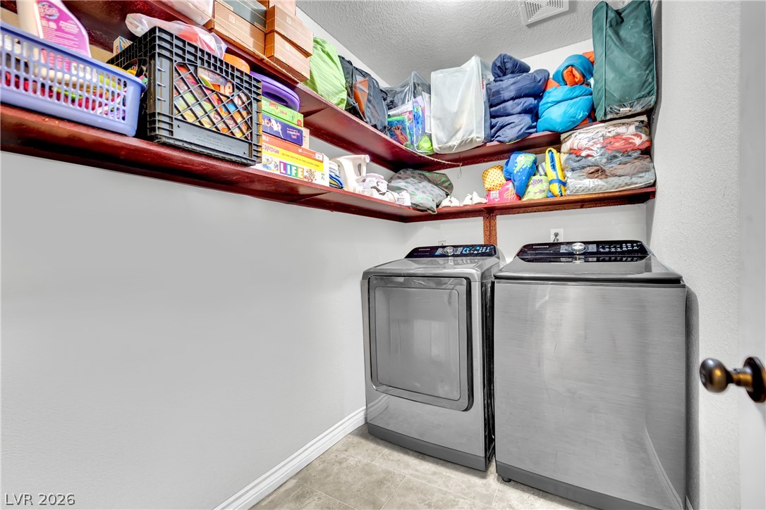 420 North Racetrack Road Henderson, NV 89015 - Photo 31 of 52 Ample storage solutions elevate this functional laundry area.