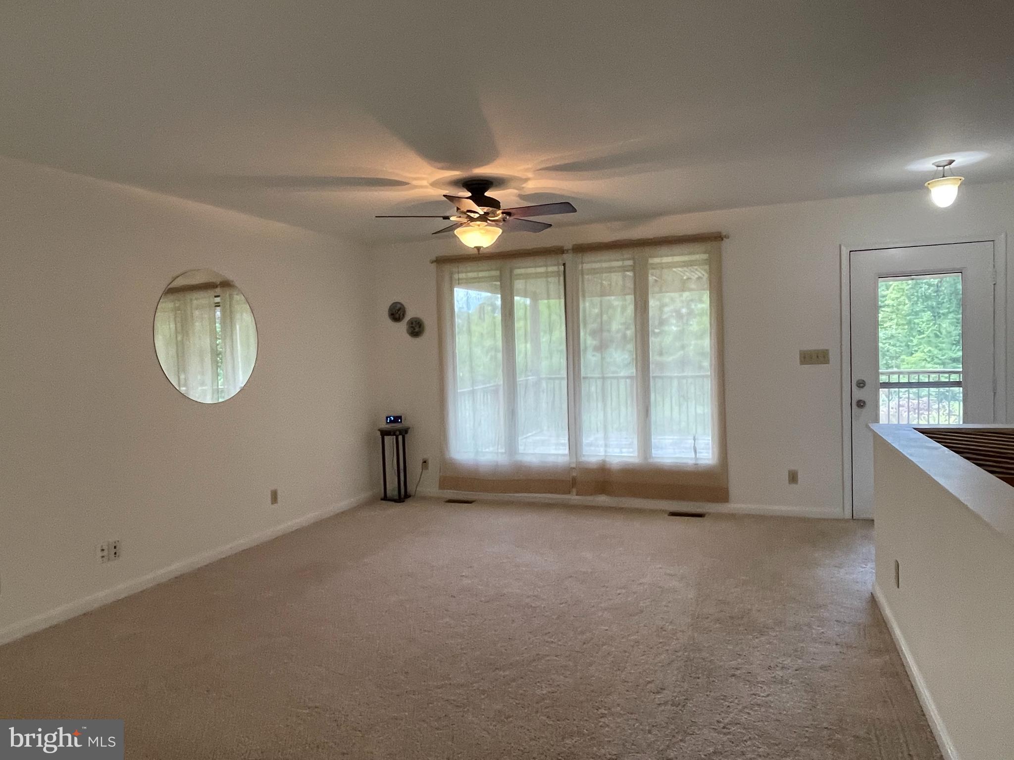 10365 River Road Rixeyville, VA 22737 - Photo 16 of 52 Main Level - Living Room View with Deck Access
