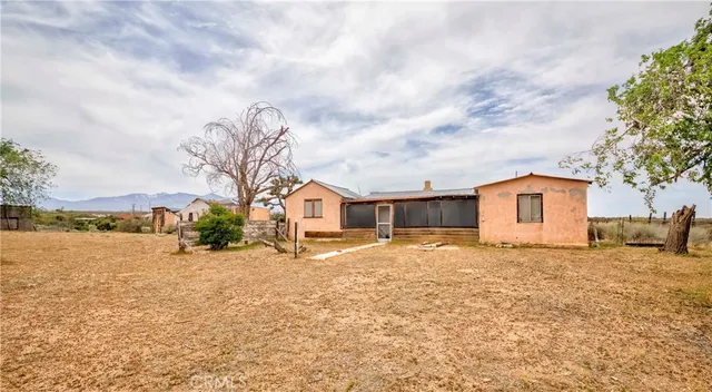 a view of swimming pool with an outdoor seating