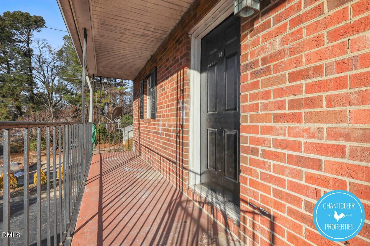 115 Florence Street, Unit 19 Graham, NC 27253 - Photo 25 of 29 a view of a balcony with wooden floor