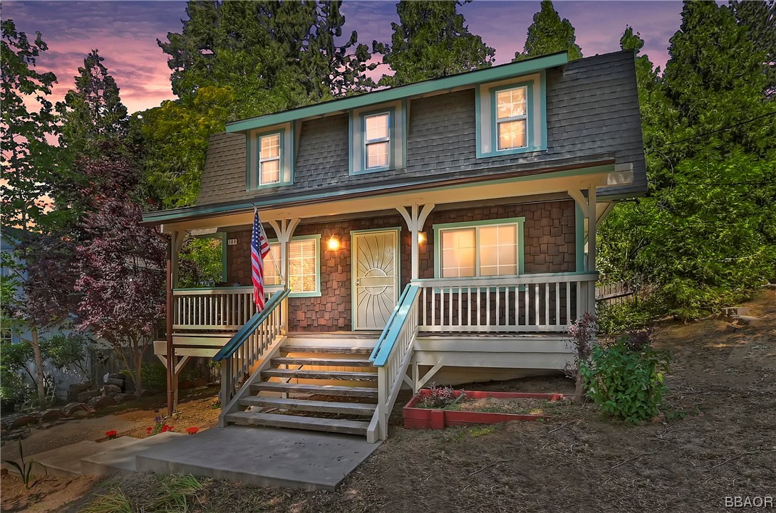 189 Pine Ridge Road Crestline, CA 92325 - Photo 1 of 30 a front view of a house with a yard
