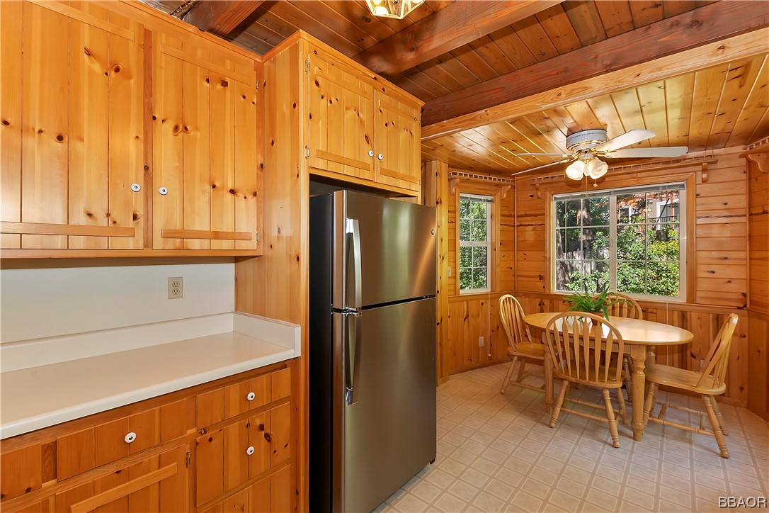 189 Pine Ridge Road Crestline, CA 92325 - Photo 13 of 30 a kitchen with stainless steel appliances granite countertop a refrigerator and a table