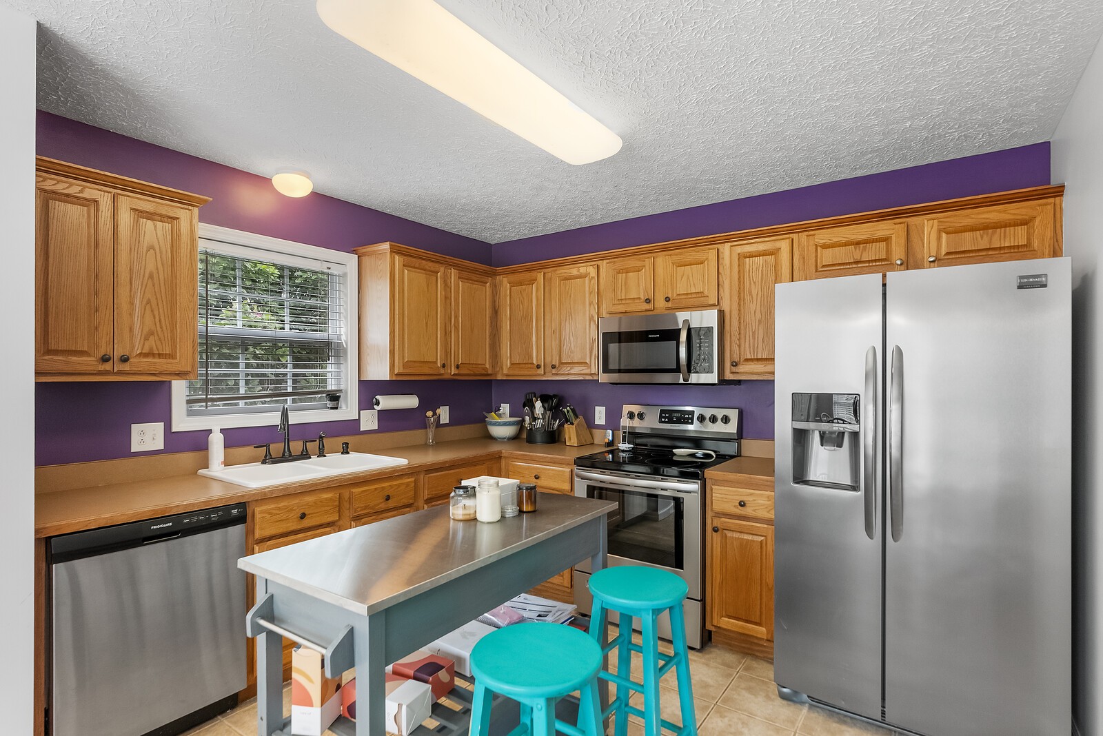 509 Berry Circle Springfield, TN 37172 - Photo 9 of 20 a kitchen with stainless steel appliances granite countertop a stove refrigerator sink and dishwasher