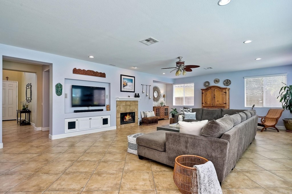1738 Star Crest Place San Marcos, CA 92078 - Photo 12 of 51 a living room with furniture and a flat screen tv