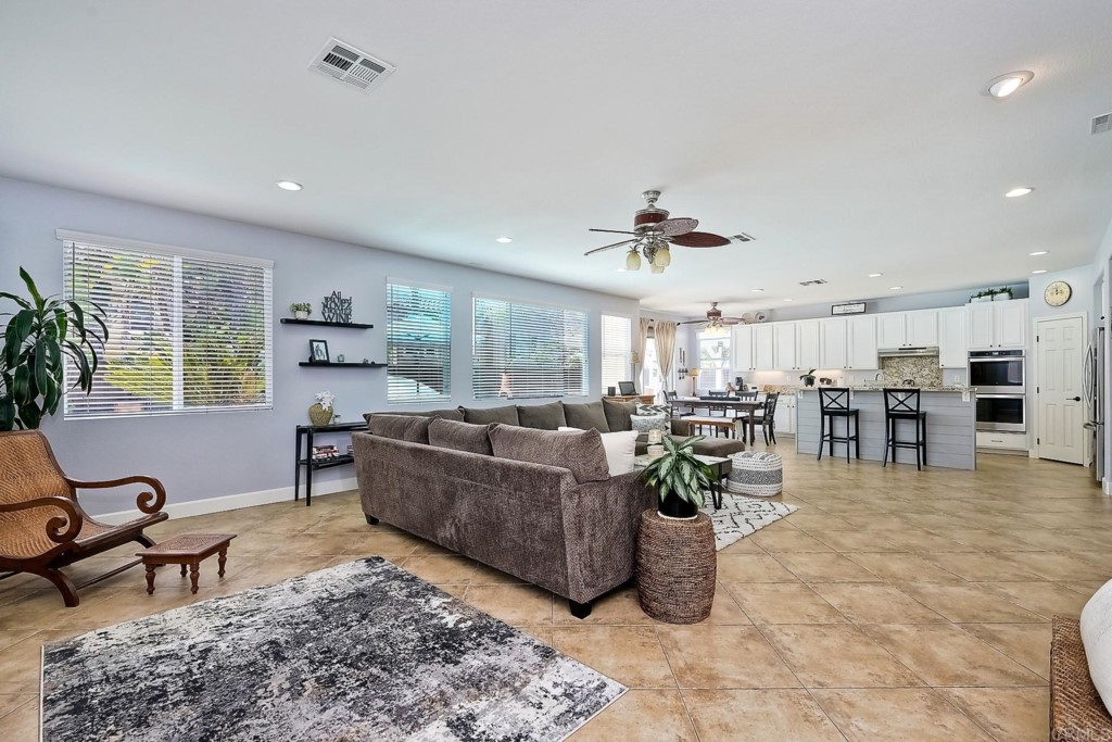 1738 Star Crest Place San Marcos, CA 92078 - Photo 15 of 51 a living room with lots of furniture and a table
