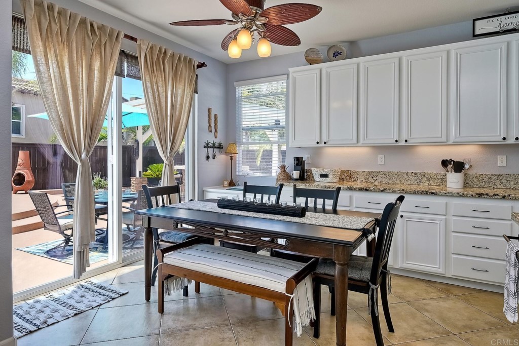 1738 Star Crest Place San Marcos, CA 92078 - Photo 21 of 51 a kitchen with a table chairs and cabinets