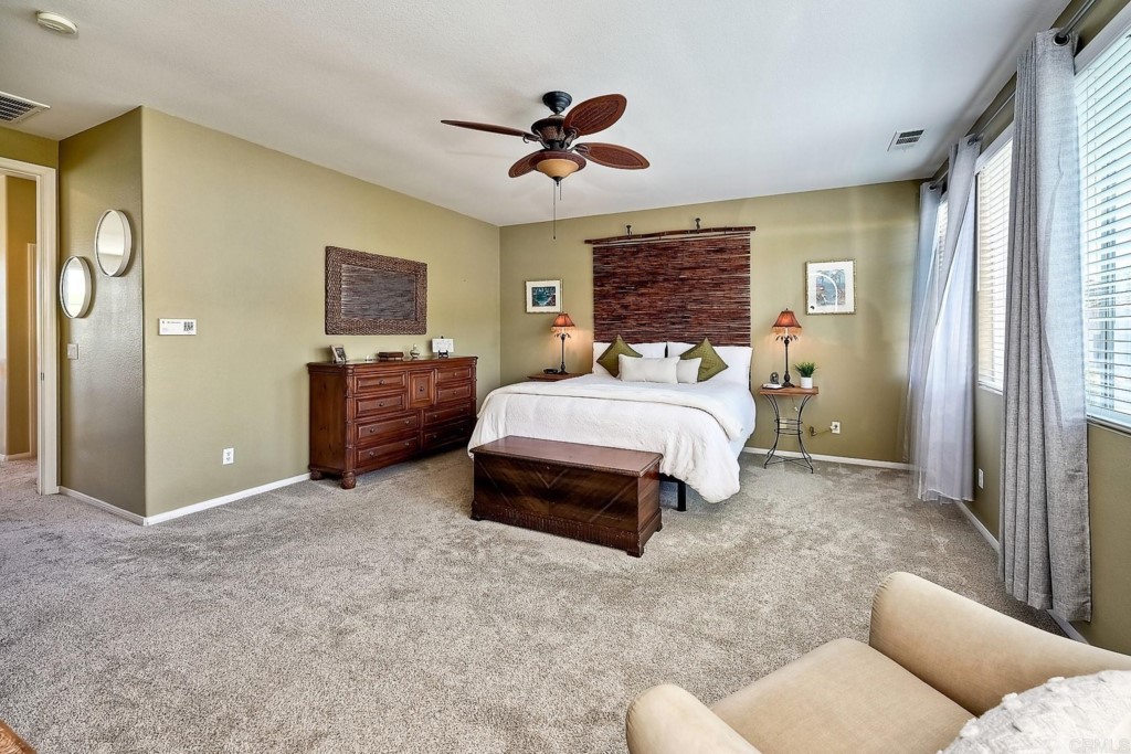 1738 Star Crest Place San Marcos, CA 92078 - Photo 26 of 51 a spacious bedroom with a bed and window