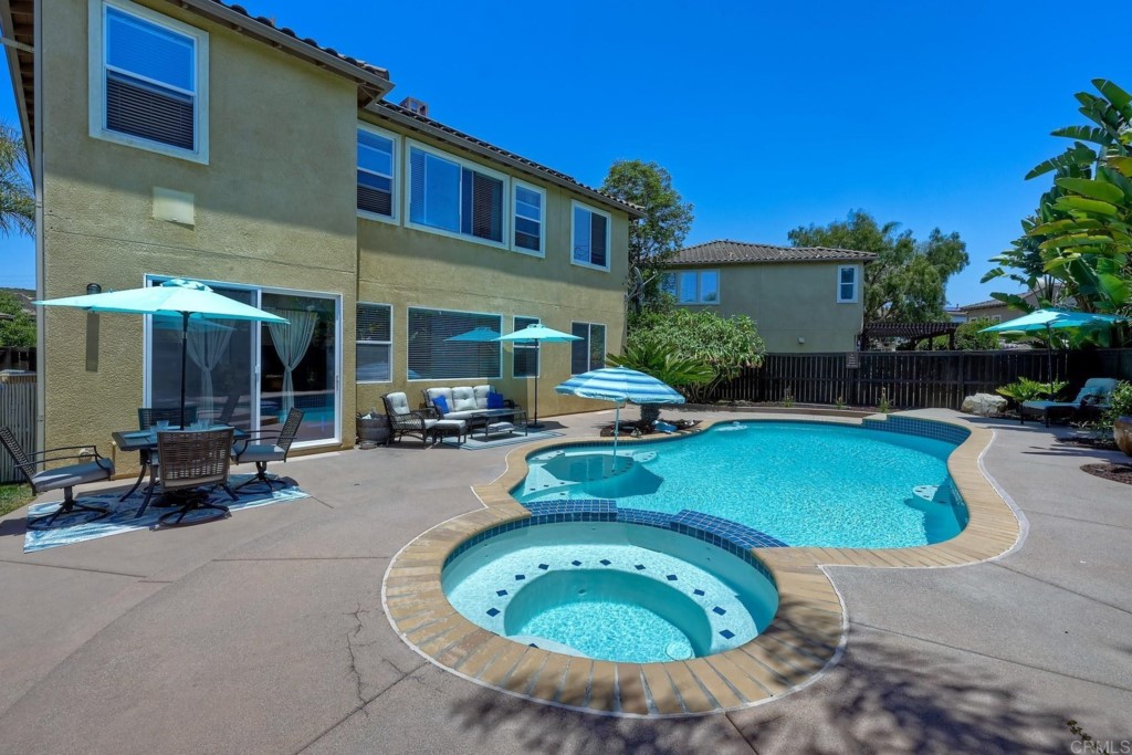 1738 Star Crest Place San Marcos, CA 92078 - Photo 41 of 51 a view of a house with backyard sitting area and swimming pool
