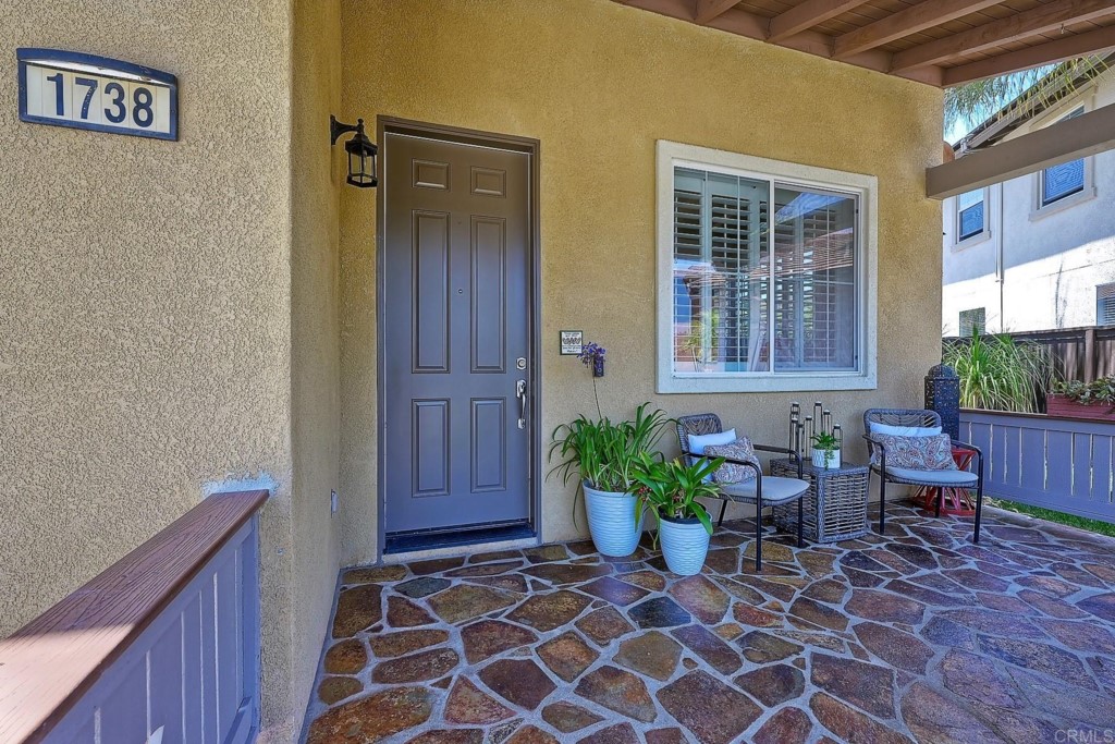 1738 Star Crest Place San Marcos, CA 92078 - Photo 8 of 51 a view of a house with chairs and table in a patio