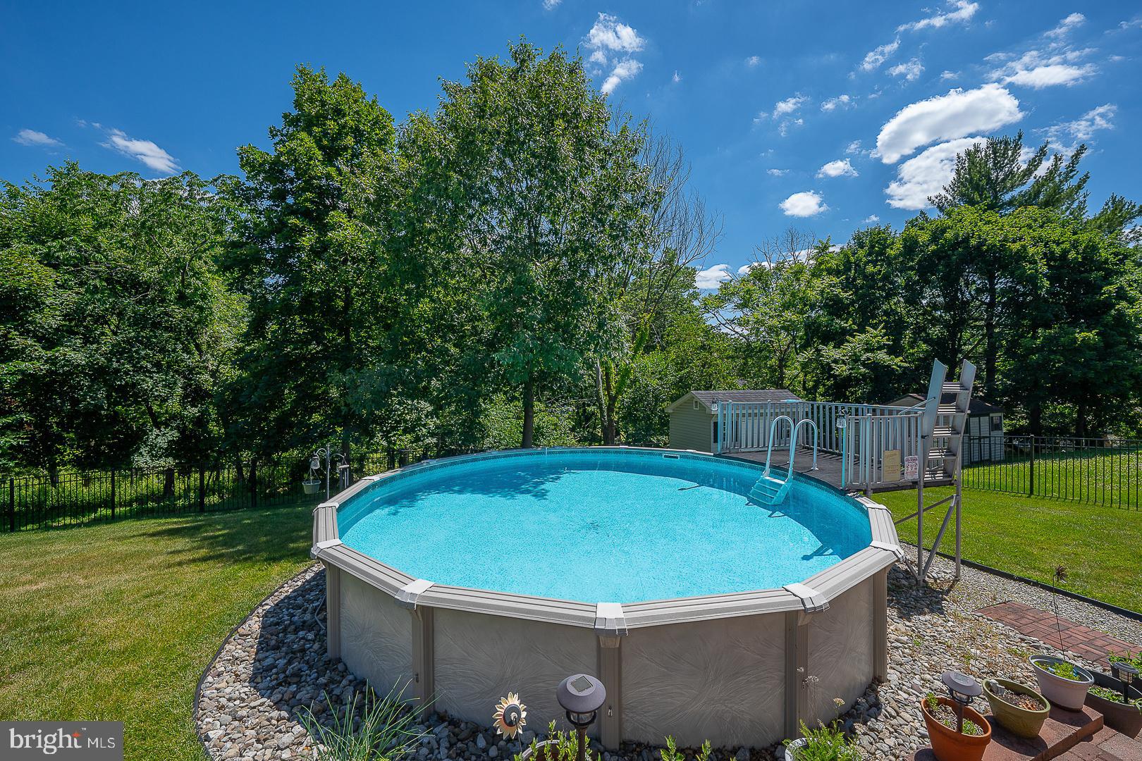 848 Mourning Dove Road Audubon, PA 19403 - Photo 64 of 86 a view of a swimming pool with a garden