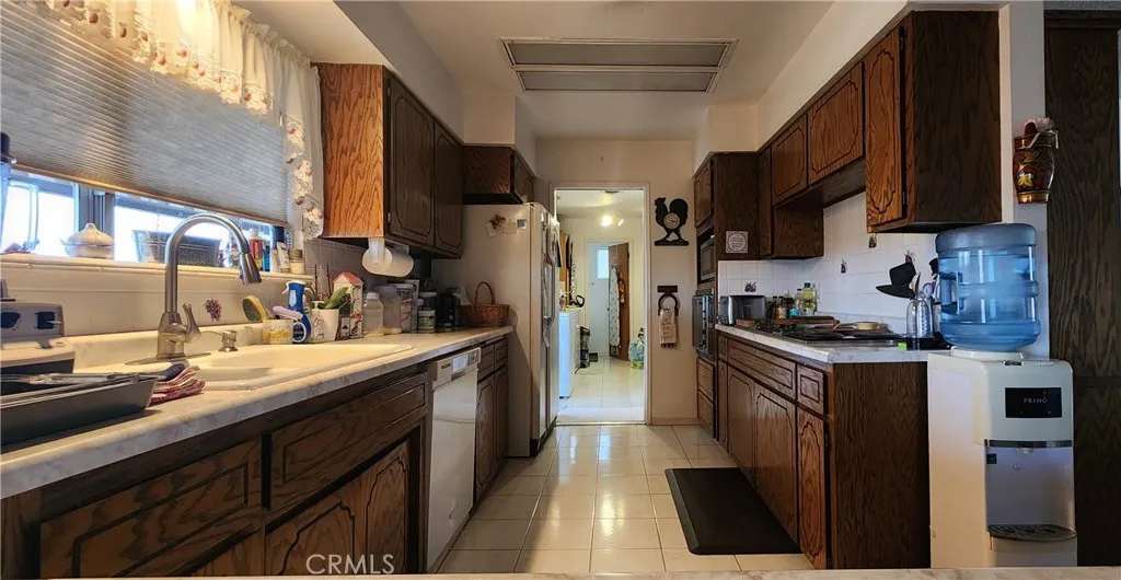 12491 Toby Lane Blythe, CA 92225 - Photo 11 of 45 a kitchen with stainless steel appliances granite countertop a sink a stove and a refrigerator
