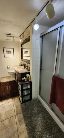 a bed room with a bed and a television