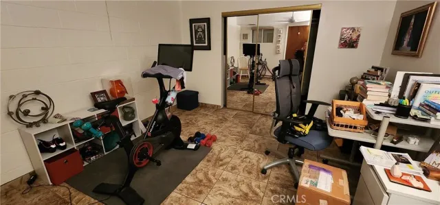 a view of a livingroom with a chair and storage