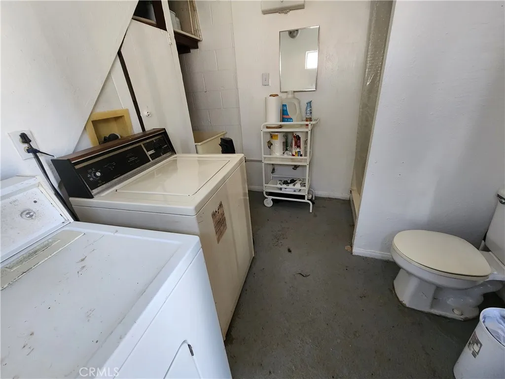 12491 Toby Lane Blythe, CA 92225 - Photo 36 of 45 a storage room with washer and dryer